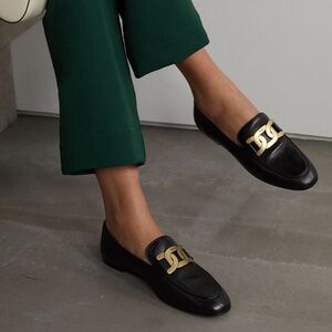 Tod's Black and Gold Kate Loafers with Elegant Hardware